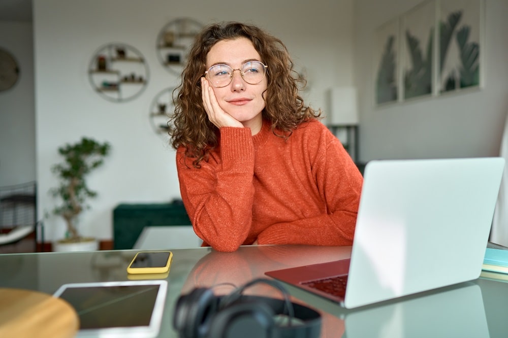 Stages of starting a business. Woman meditating at the computer