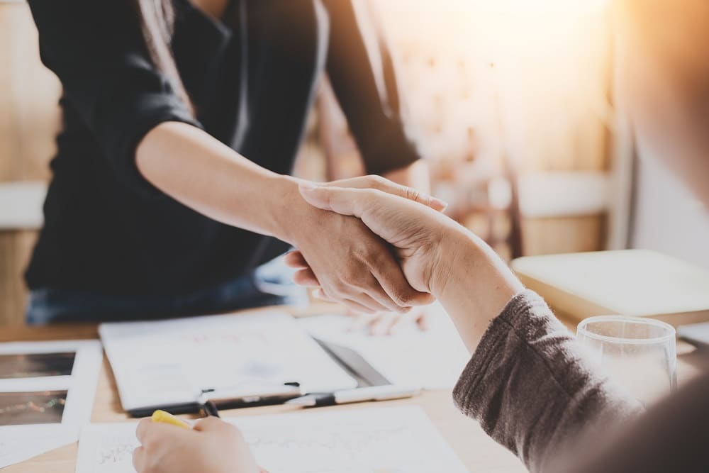 Stages of starting a business. Employer shakes hands with employee